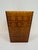 Vintage amber plastic waste basket with molded geometric pattern and raised medallion design. Tapered rectangular form...