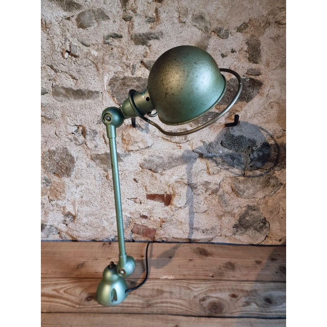 An original Jielde articulated desk lamp, produced in France and dating from the 1960s–1970s. Designed for industrial and...