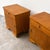 A charming matching pair of vintage art deco bedside cabinets, dating from circa the 1930s–1940s. Each cabinet features a...