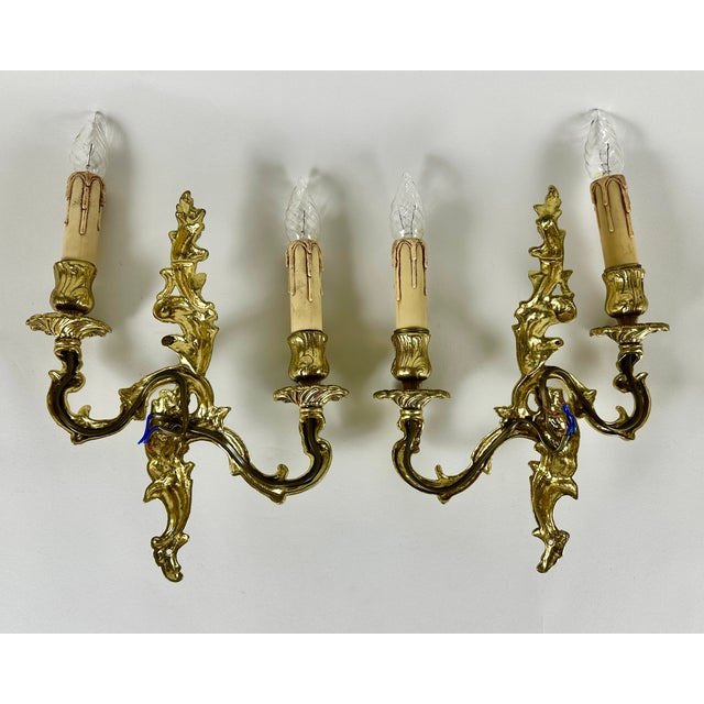 Introduce a touch of French elegance to your home with this exquisite pair of vintage gilt bronze sconces. Originating...