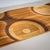 Bench crafted from a combination of woods, including maple, beech, cherry, and walnut. The eponymous ripple effect flows...