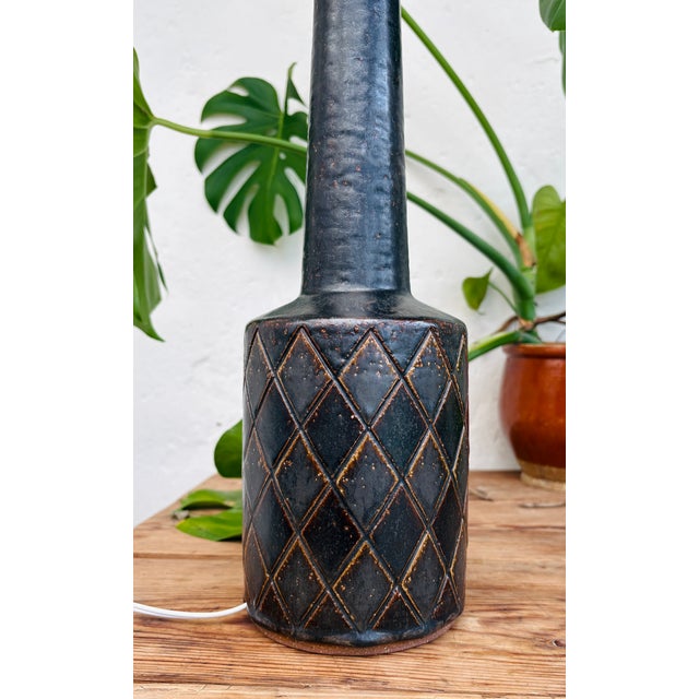 Design: Per Linnemann-Schmidt, 1960s This Palshus table lamp, model DL 32, is more than just a lighting fixture. It is a...