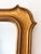 Vintage Belgian gildwood mirror in Napoleon III style, with a wide wooden frame and subtle shoulders at the corners. The...