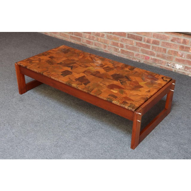 Sculptural coffee table designed by Percival Lafer composed of a visually striking copper patchwork/mosaic surface...