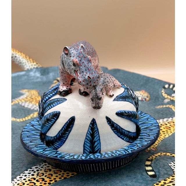 A finely hand-crafted ceramic butter dish by Ardmore Ceramics, South Africa, featuring an exquisitely sculpted and painted...