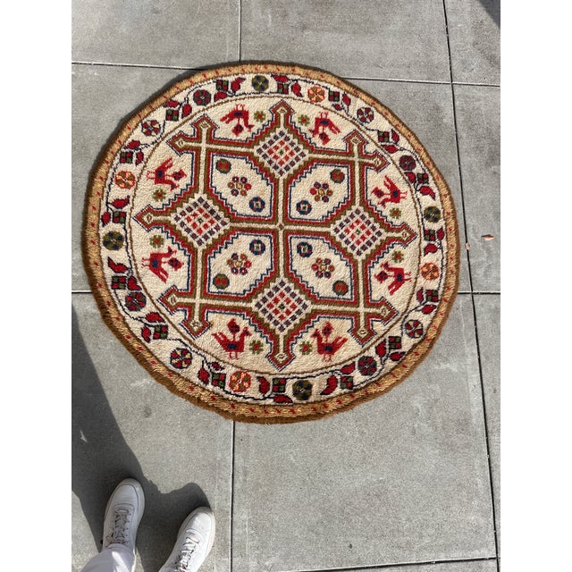 The piece features a distinct Kazak (or Caucasian) geometric style. This is characterized by bold, structured lines,...