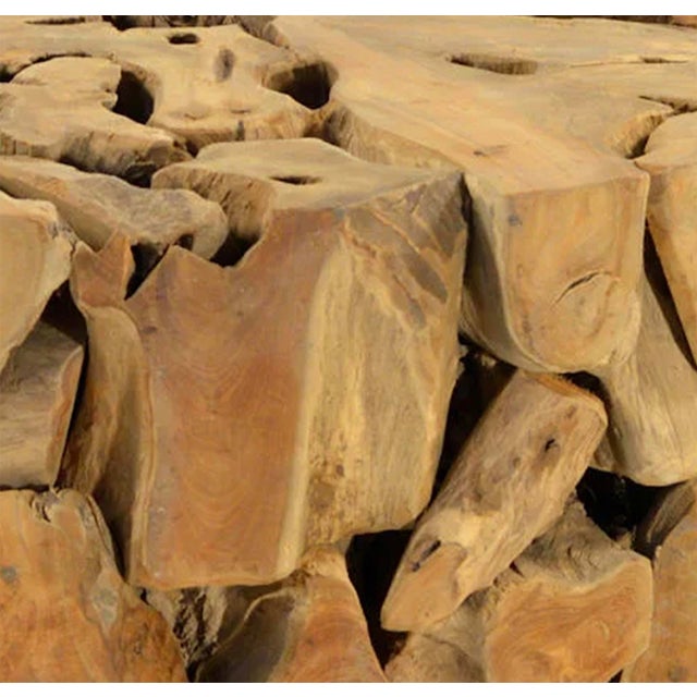 Beautiful sculptural coffee table handcrafted from natural solid teak root fragments arranged to create an organic round...