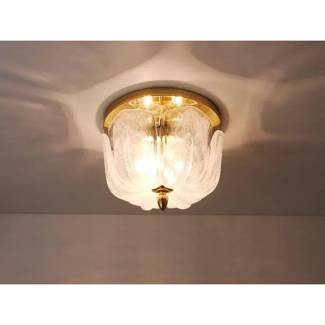 A beautiful ceiling light or flush mount from the 1970s, executed by Limburg, Germany. It has a brass base with three...