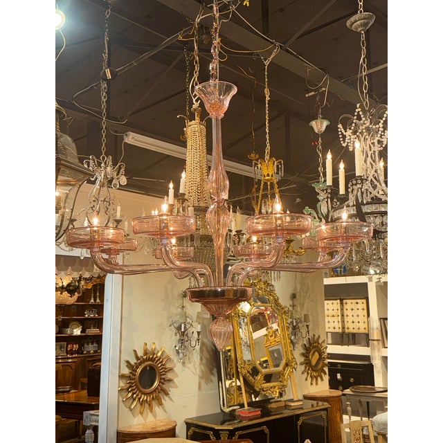The Murano Pink Glass Chandelier is a stunning and elegant lighting fixture. Featuring 8 arms and beautiful glistening...