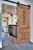 This handcrafted solid wood interior door showcases a refined Mediterranean–Tuscan influence, featuring deep ornamental...