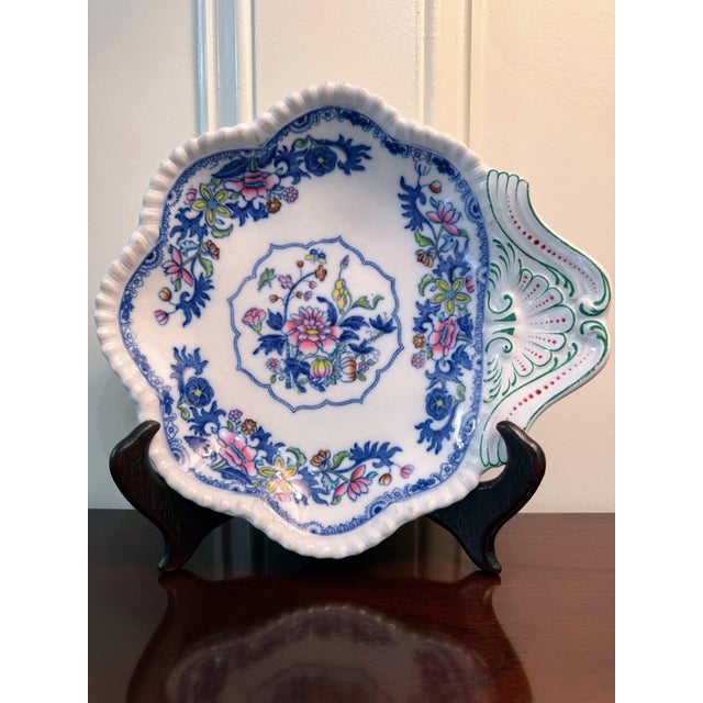 A distinctive antique Copeland Late Spode serving dish with shell-form handle made for the celebrated London retailer Heal...