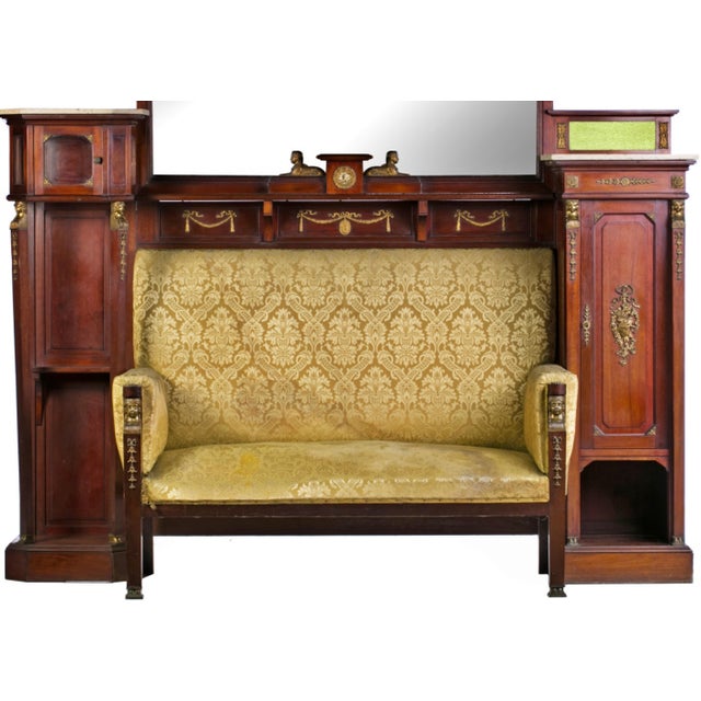 FURNITURE WITH SOFA 19th century Empire style. Made of mahogany wood, with bronze applications, decorated with vegetal...