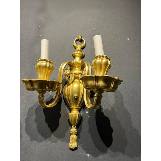 pair of circa 1920’s Caldwell gilt bronze sconces with unusual cups