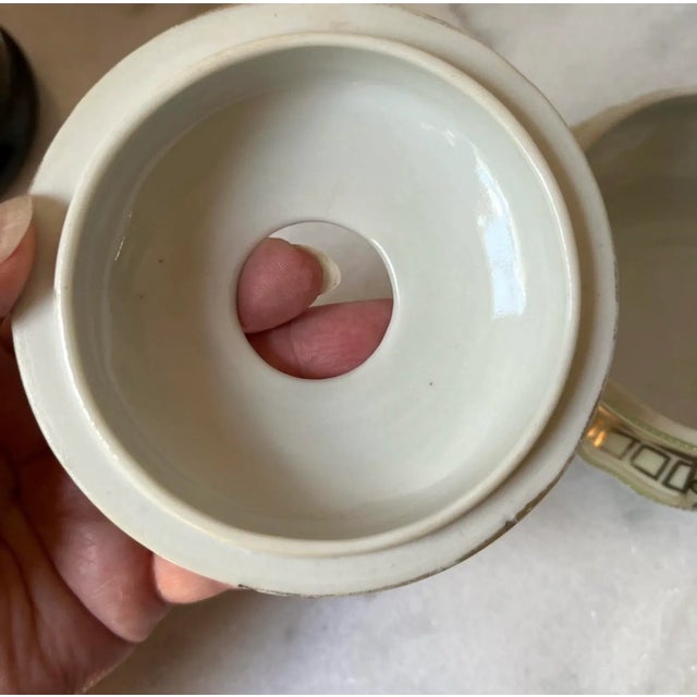 This is an antique Nippon porcelain hair receiver. It is a decorative box with a hole in the lid, used in the Victorian...