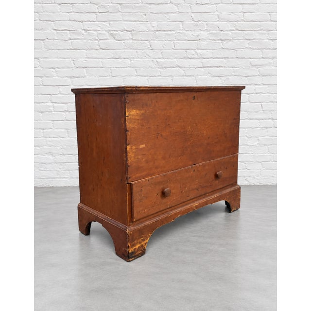 Shaker style wooden Pine Blanket Chest with a lift top compartment on top and a wide and deep lower drawer. Round wooden...