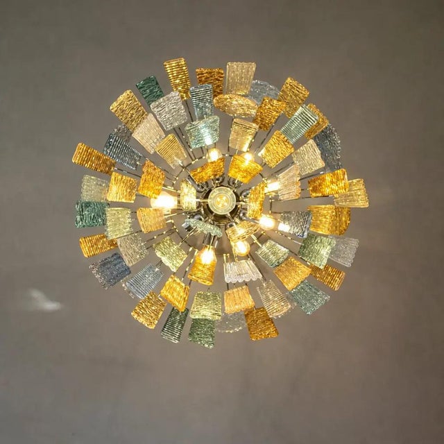 Scenographic chandelier with strips “Listelli ” elements of Murano glass worked with traditional tecnique in “piastra”...