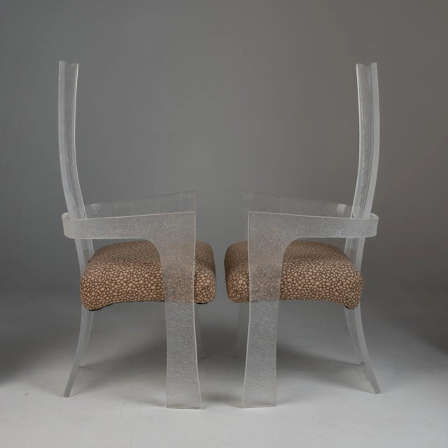 A fantastic pair of tall or high back lucite armchairs with clear and textured, frosted lucite panels with a curved,...