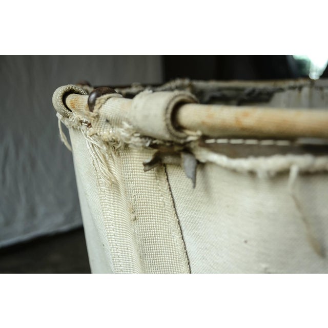 Vintage canvas laundry bag on metal frame. Constructed for Morris & Co Laundry, Groveville, NJ in 1924. Company logo on bag.
