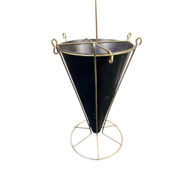 This vintage brass metal umbrella stand is the perfect addition to your entryway - with eye catching mid-century atomic...