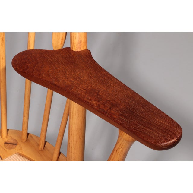 The iconic JH-550 Peacock Chair, designed by renowned architect and designer Hans J. Wegner in 1947, was crafted by...