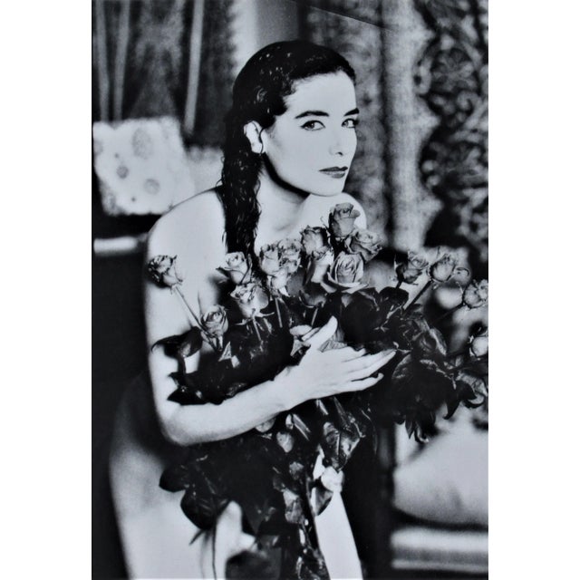 This photograph "Untitled, Woman with Flowers" c.1980 is an original gelatin silver print by famous German photographer...