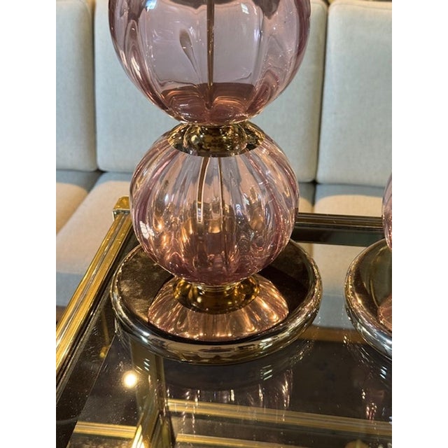 The Pair of Murano Lavender Ball Lamps is a beautiful set that add a touch of elegance to any room. Their unique design...