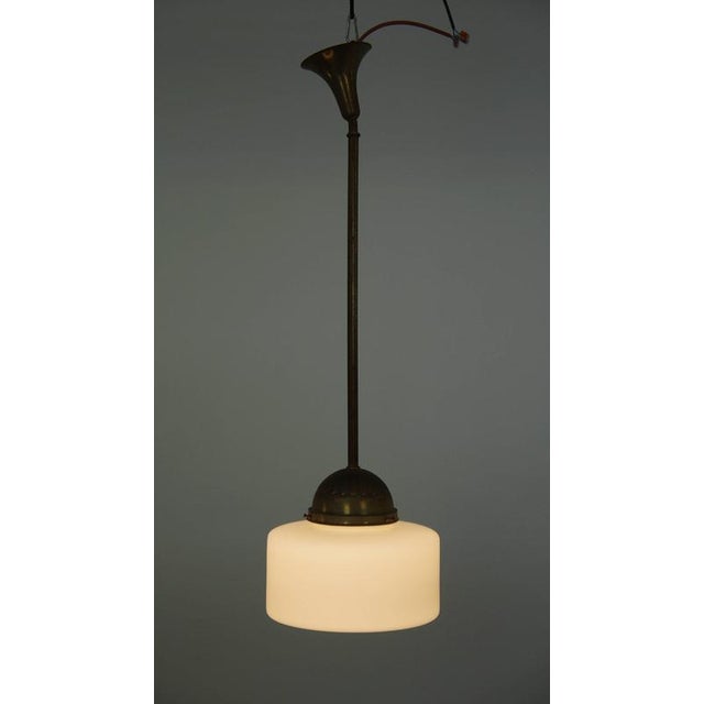 We are offering this classic vintage pendant lamp featuring glass and brass. This vintage pendant lamp is a distinctive...