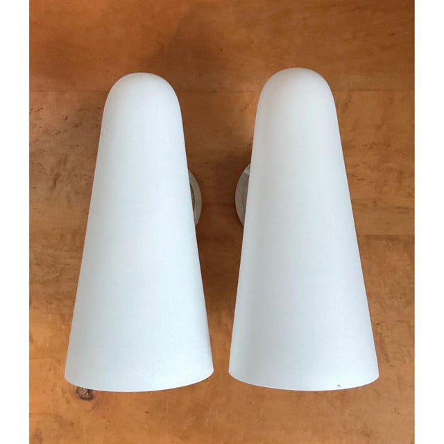 Embrace minimalist elegance with this sophisticated pair of Mid-Century Modern cone wall sconces. Each fixture features an...