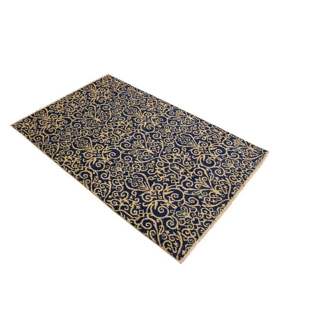 This elegant hand knotted rug features a modern fusion of beauty, with its interlocking geometric and minimalist pattern....