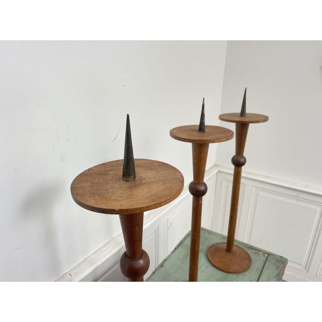 Three superb Brutalist-style solid wood candlesticks, made in the 1950s and sourced from a former church in Lyon. Slender...