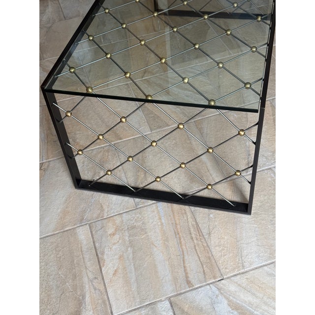 This striking 48W x 24D x18H bronze and steel coffee table with signature lattice frame and matching top design fuse into...