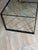 This striking 48W x 24D x18H bronze and steel coffee table with signature lattice frame and matching top design fuse into...