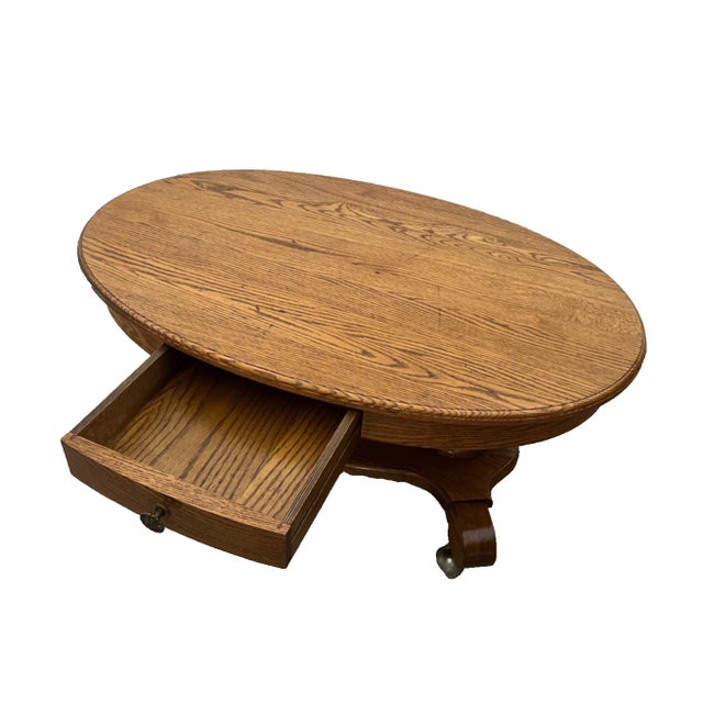 1970s Oval Coffee Table Tiger Oak, Center Drawer, Shelf, Empire Style, Caster Wheels For Sale - Image 5 of 13