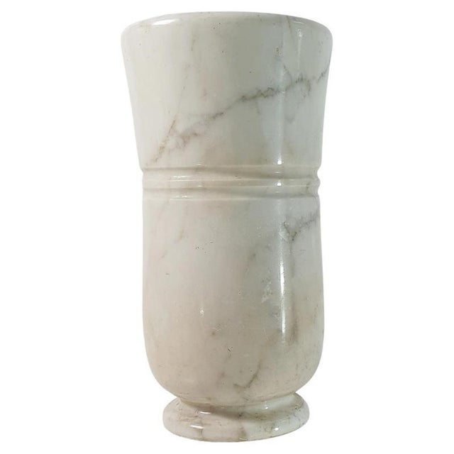 Elegant 1950s umbrella stand made from one piece solid carrara marble with a a copper insert to collect water. This...