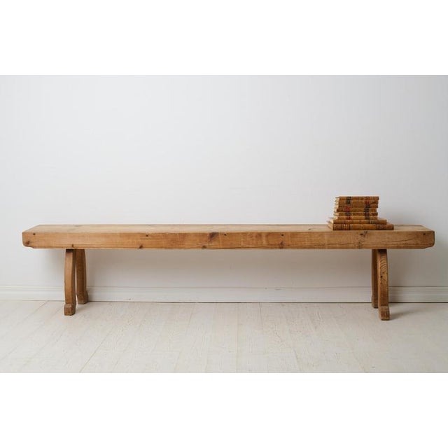 Rustic antique long bench from the 1800s. The bench is a Swedish country house furniture made around 1840 in northern...