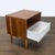This West Elm nightstand features a warm wood finish and classic mid-century modern design. It offers one spacious open...