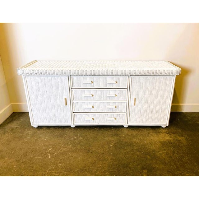 185cm wide x 51cm deep x 80cm high Excellent quality French white rattan 1970s sideboard.Sourced in France. Heavy piece...