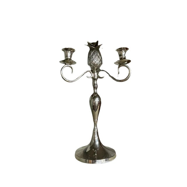 Add a refined tropical charm to your décor with this beautifully crafted pewter pineapple candelabra. Symbolizing...
