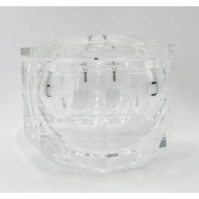 Add a touch of vintage glamour to your home bar with this stunning Faceted Lucite Ice Bucket attributed to Alessandro...