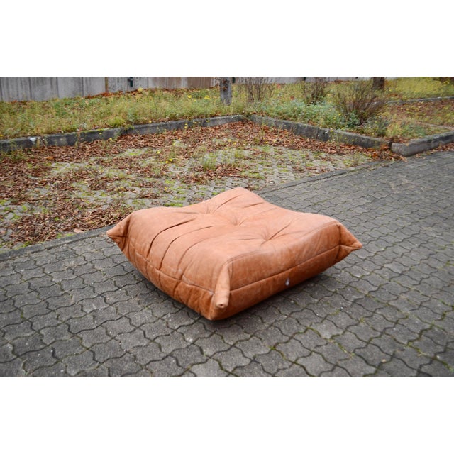 Original Ligne Roset Pouf / Ottoman in cognac leather. It was recoverd with cognac coloured leather many years ago. Good...