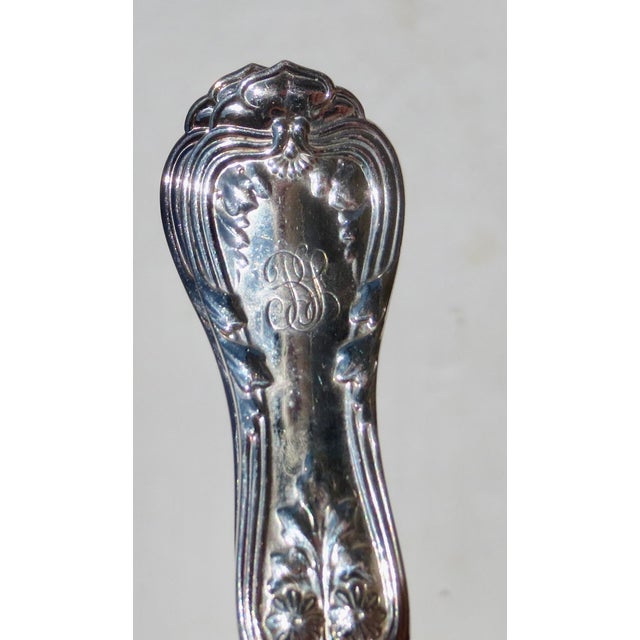 Tiffany & Co set of 12 forks. English Kings pattern with a monogram on the handle B. L.. The measurements are 7.25" long...