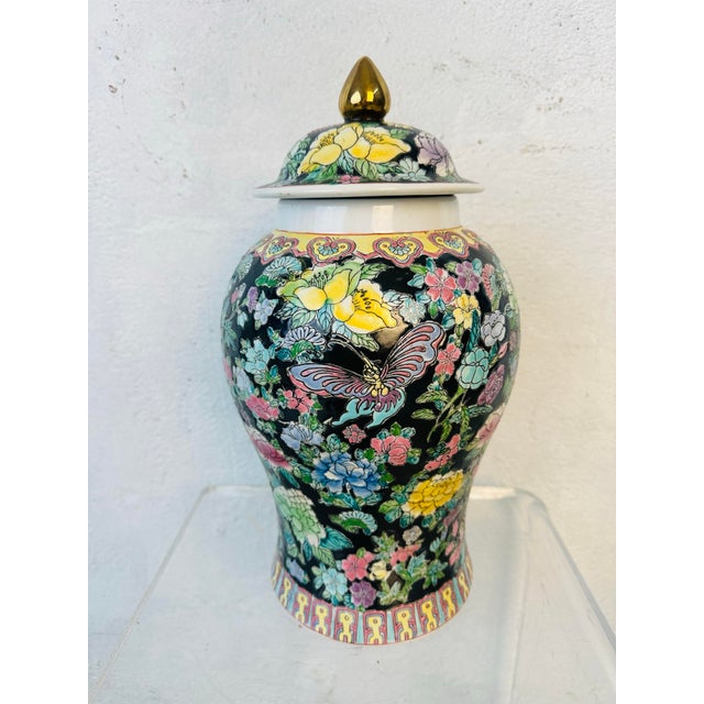This is a traditional Chinese porcelain jar, often referred to as a Ginger Jar. Here’s a detailed description • The jar...