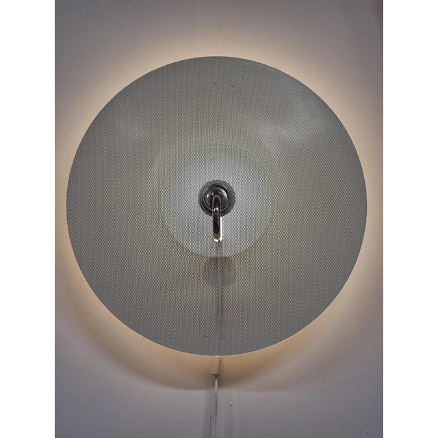 Metal shade holder with few smaller dents, probably from when shade has been removed. This piece is attributed to the...