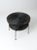 A mid-century black wicker side table with a two-tier design featuring round woven surfaces and slim metal legs. the airy...
