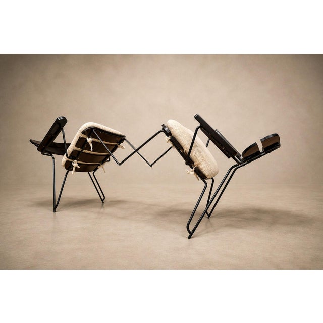 A disciplined study in structure and restraint, this set of three armchairs by Carlo Hauner distills the architectural...