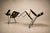 A disciplined study in structure and restraint, this set of three armchairs by Carlo Hauner distills the architectural...