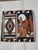 Beautiflu tile is earthtones and southwestern geometric patterns. Howling coyotes are the focus point and this tile is...