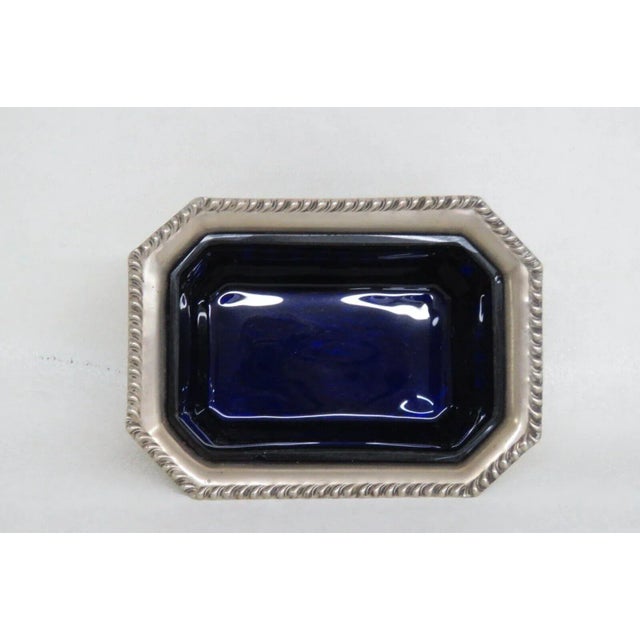 This wonderful salt cellar dish is made of glass and electroplated nickel silver. This piece is stamped as being made in...