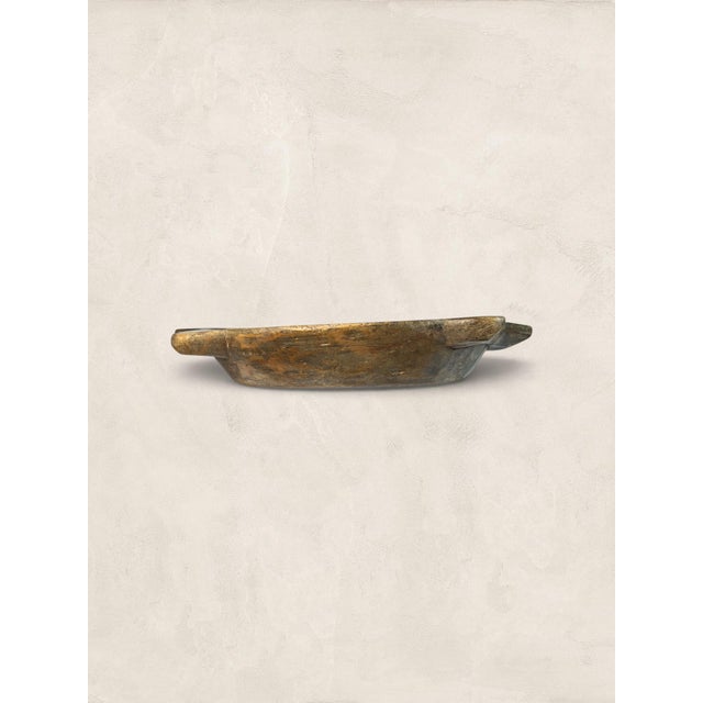 Hand-hewn from solid oak, this antique dough bowl carries the quiet evidence of a working kitchen. Flour-dusted, bread-...