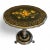 A late 19th century pine English Victorian tilt-top table; ebonized and featuring abalone inlays among elaborate paint...